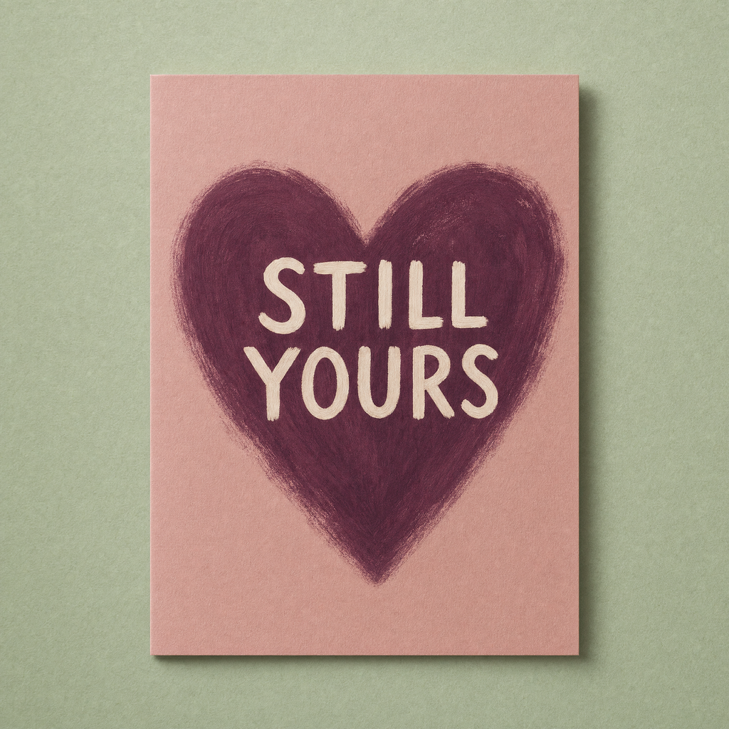 Still Yours card: a brush-painted plum heart on a dusty rose card with cream lettering