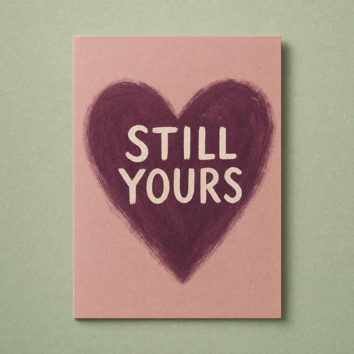Still Yours card: a brush-painted plum heart on a dusty rose card with cream lettering