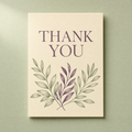 Thank You card: plum serif lettering above sage and plum laurel branches on a cream card