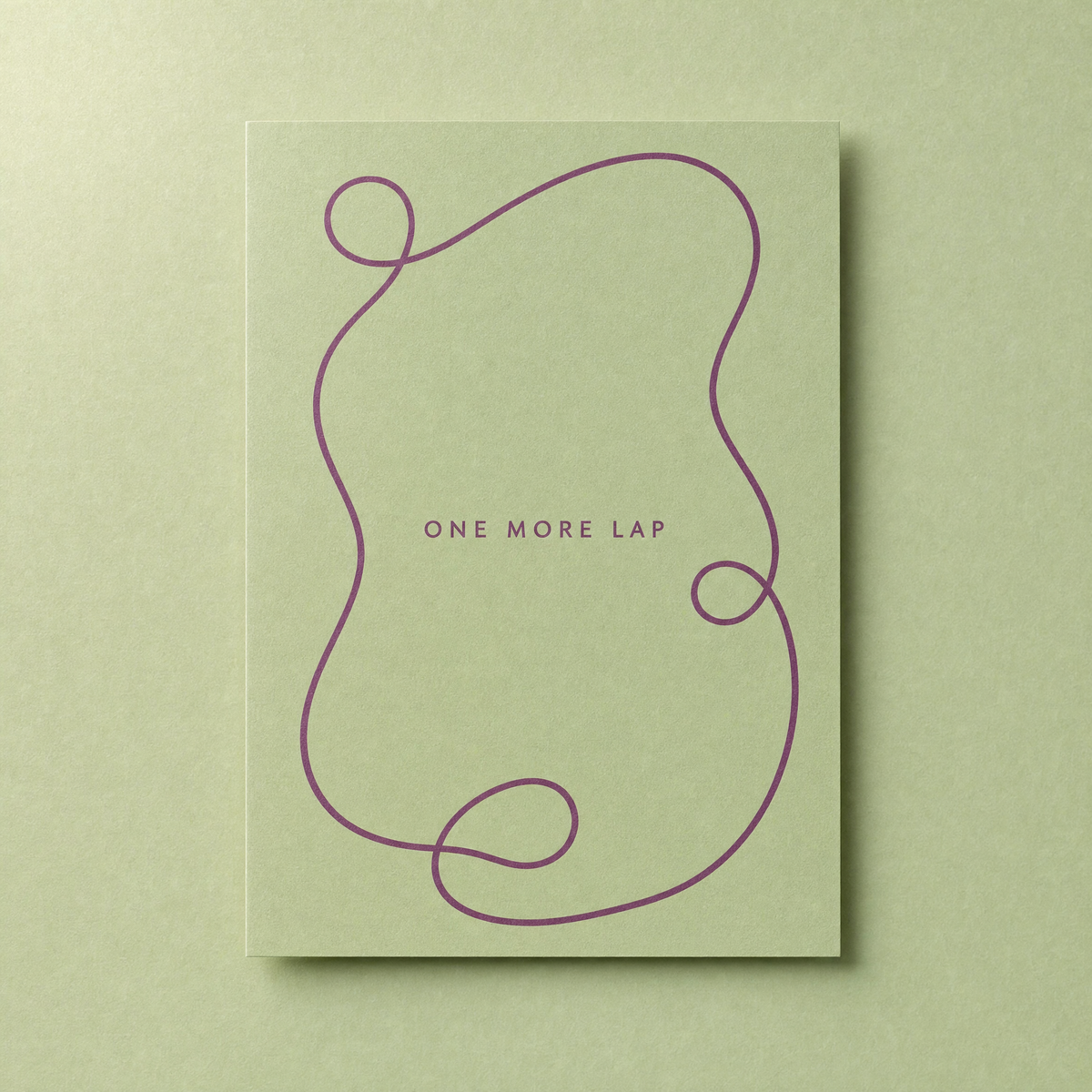 One More Lap card: a single looping plum line on a sage green card